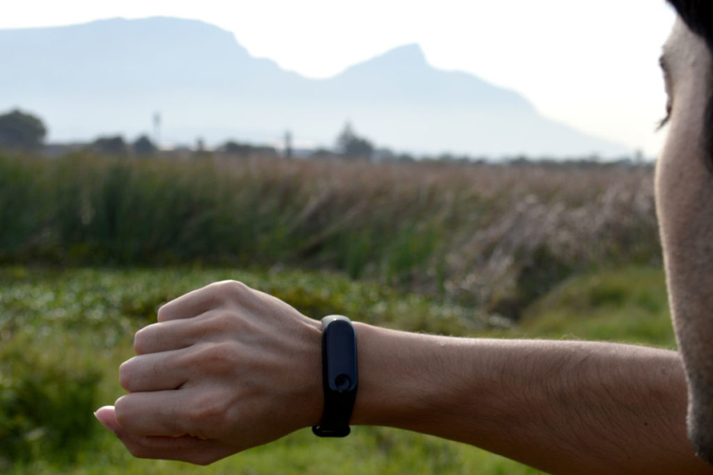 A person looking at their fitness tracker