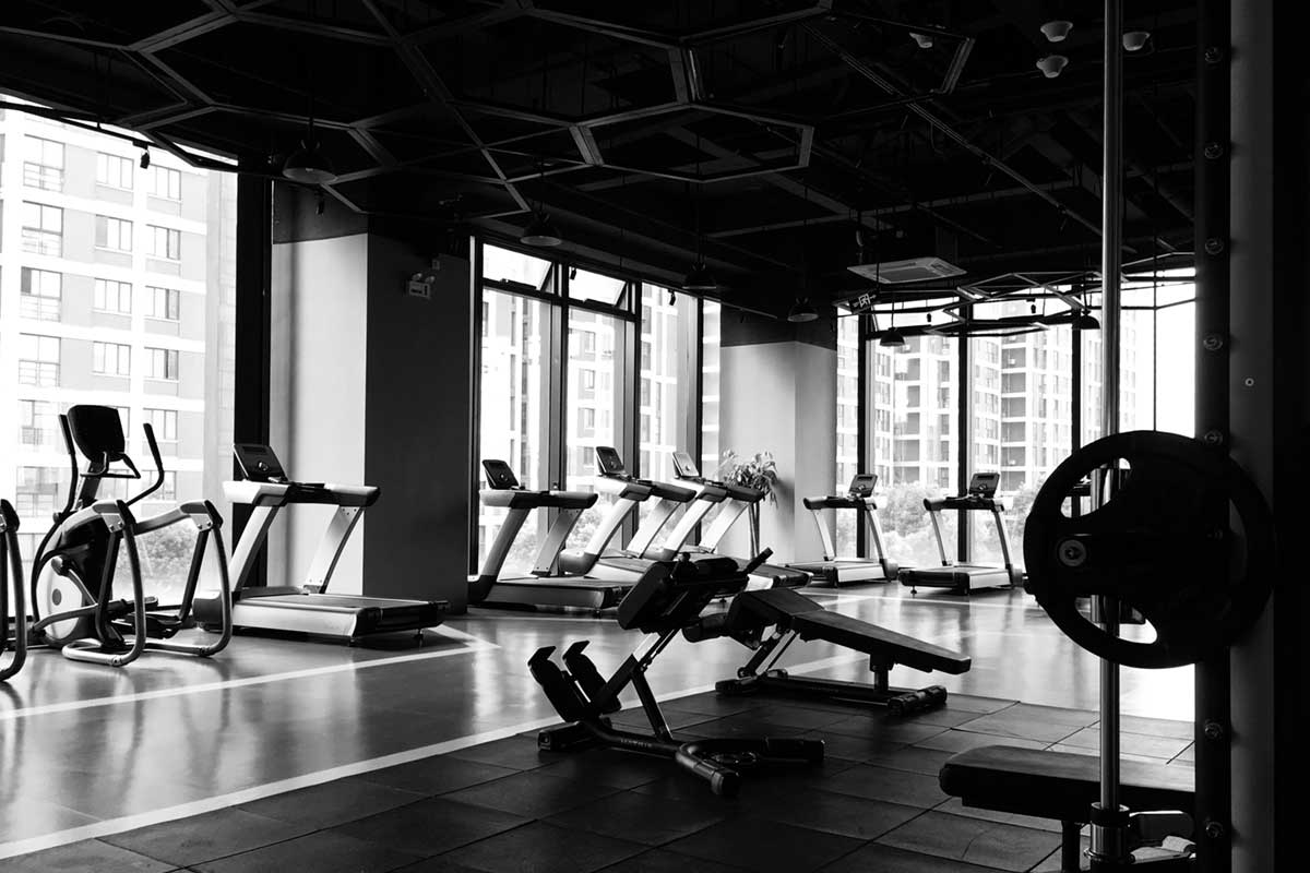 black and white image of the inside of an empty gym