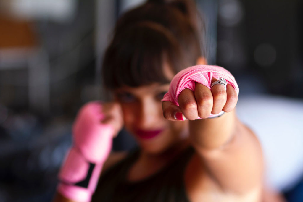 Woman jabbing towards camera